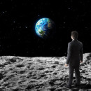 businessman walks on moon surface
